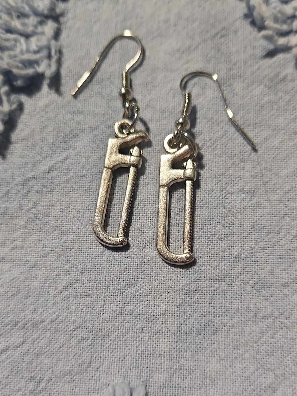 Silver Tone Saw Charm Drop Earrings